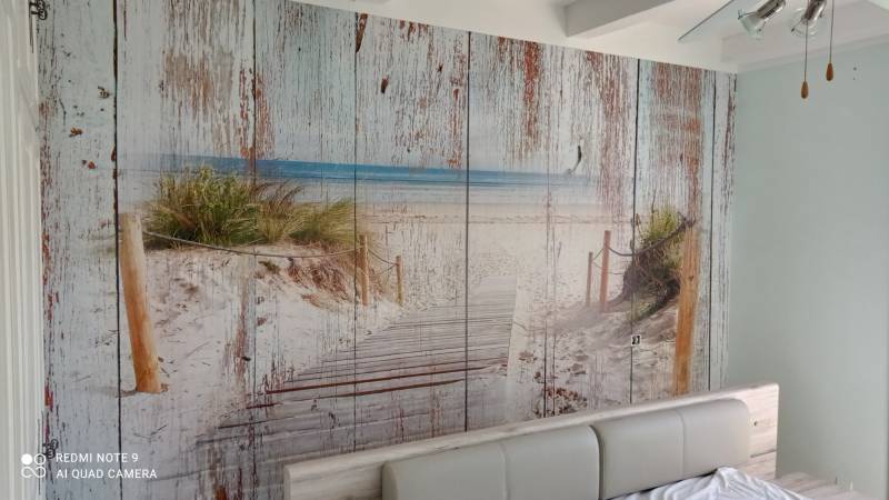 Pose d’un papier peint en trompe-l'œil dans une entrée d’appartement sur Aix-en-Provence